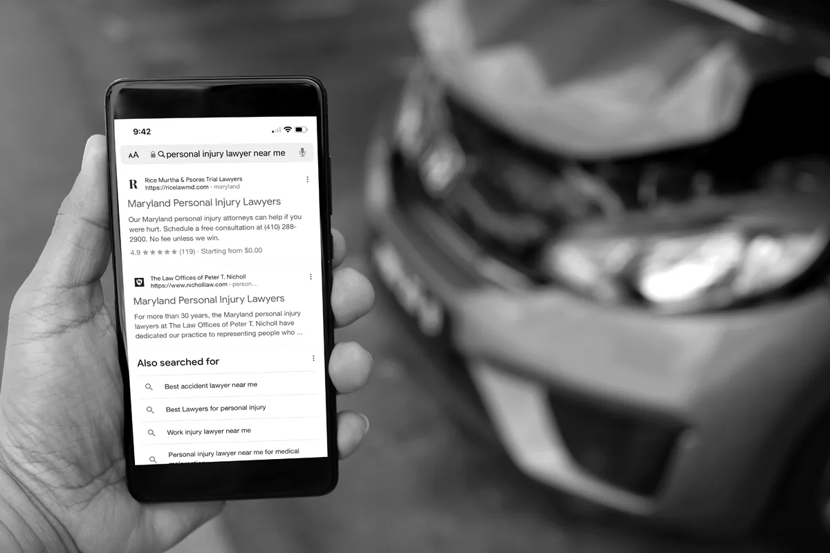 Car Accident Google Search, shows person performing search on their phone after a car accident