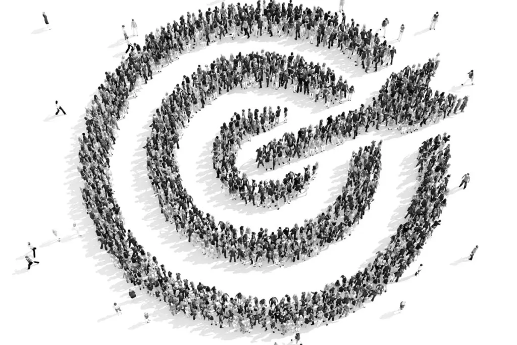 A crowd of people in the shape of a bullseye, shows the precision targeting of digital marketing