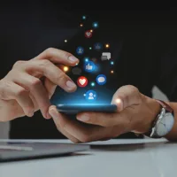 Business Owner sees the benefits of well-run social and ad campaigns on their smartphone