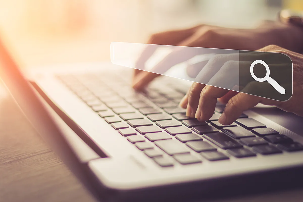 Client searches for local businesses on a search engine from their laptop