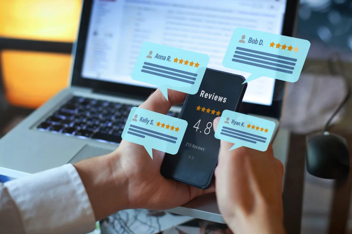 Local Business Owner Manages Online Reviews on a Smart Phone