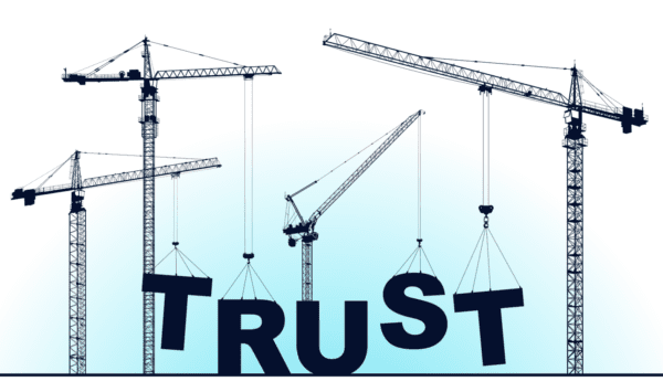 Construction cranes build the Word Trust with giant building-sized letters