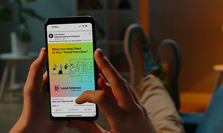 A potential client leans back on a couch, scrolling a digital advertisement on his smartphone