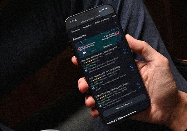 A smartphone screen shows search engine business listings to represent the value of local SEO